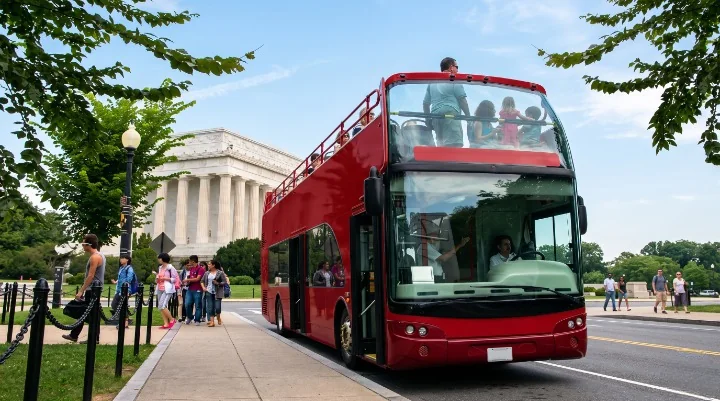 Red open-top Washington DC hop-on hop-off sightseeing bus beside the Lincoln Memorial